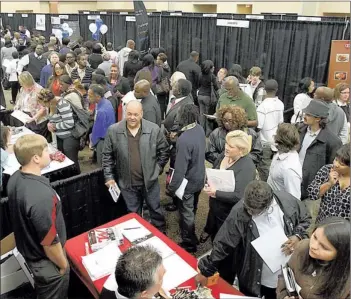  ?? STAN CARROLL/ THE COMMERCIAL APPEAL ?? July’s jobless rate in metropolit­an Memphis eased to 9.5 percent, but has surpassed 8 percent for more than four years, leading to a series of crowded job fairs like this one in October 2012 at Landers Center in Southaven.