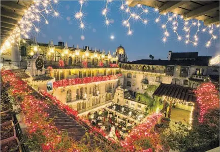  ?? Brian van der Brug ?? Los Angeles Times THE MISSION INN in Riverside will kick off its annual Festival of Lights on Nov. 24 with a fireworks show. More than 5 million colorful lights and more than 200 animated figures are included. There also will be window displays and...