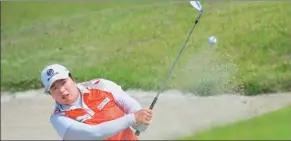  ?? PROVIDED TO CHINA DAILY ?? Feng Shanshan, China’s No 1 female golfer, chips out of a bunker during a practice round for the Kumho Tires Ladies Open in Weihai, Shandong province, on Wednesday.