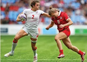  ?? ?? England’s ex-hartpury student Abbie Brown is tackled by Canada’s Piper Logan