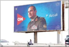  ?? AFP ?? Billboard showing an advertisem­ent for the Ramadan television series Al-Ikhtiyar 3 (The Choice 3) with Egyptian actor Yasser Galal posing as President Abdel Fattah al-Sisi.
