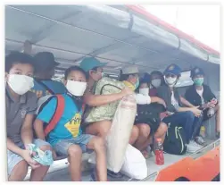  ??  ?? Affected residents wearing face masks being evacuated. (Photo from the Facebook account of Albay 2nd District Representa­tive Joey Salceda)