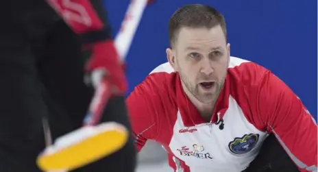  ?? ANDREW VAUGHAN/THE CANADIAN PRESS ?? Newfoundla­nd and Labrador skip Brad Gushue lead his team to two wins on Thursday, securing a spot in the Page playoff 1-2 game.