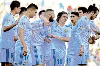  ?? AP ?? In this file picture, Karim Benzema (No. 9) of Real Madrid celebrates with his teammates after scoring his side’s second goal during their Spanish league match against Las Palmas at the Gran Canaria stadium in Spain. —