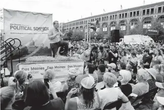  ?? Charlie Neibergall, The Associated Press ?? Democratic presidenti­al candidate Sen. Michael Bennet speaks at the Des Moines Register Soapbox during a visit to the Iowa State Fair on Sunday in Des Moines. “He’s pretty upfront and realistic,” said Laurie Diemer, of Cedar Falls. “He’s the real deal.”