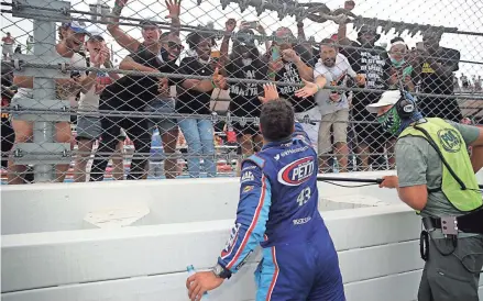  ?? GETTY ?? Fans show support for Bubba Wallace after the NASCAR Cup Series GEICO 500 at Talladega Superspeed­way Monday.