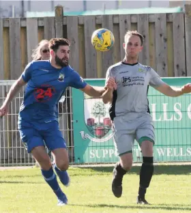  ?? Picture: Jason Bryant ?? A Hengrove Athletic player, right, battles for the ball during the 2-0 defeat at Wells City this season