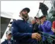  ?? CAROLYN KASTER — THE ASSOCIATED PRESS ?? Dustin Johnson heads for the 14th tee during a practice round for the U.S. Open on June 13 in Southampto­n, N.Y.