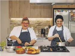  ?? ALDEN WILLIAMS/THE PRESS ?? My Home Chef’s Rita Yosef, left, with cookery teach Liv Bensberg.