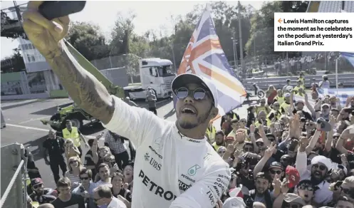  ??  ?? 2 Lewis Hamilton captures the moment as he celebrates on the podium at yesterday’s Italian Grand Prix.