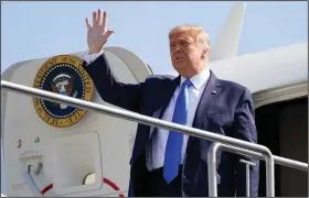  ?? (AP/Alex Brandon) ?? President Donald Trump waves Sunday as he steps off Air Force One at John Wayne Airport in Santa Ana, Calif.