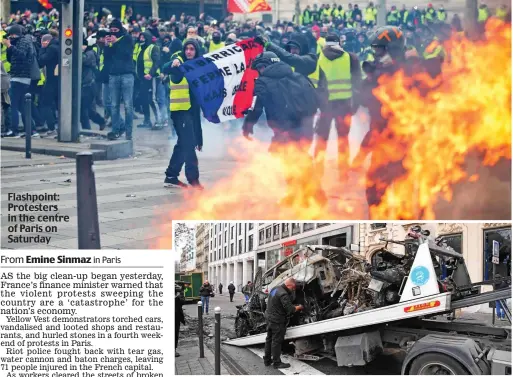  ??  ?? Flashpoint: Protesters in the centre of Paris on Saturday Clearing up: A burnt-out car is loaded on to a trailer yesterday in the capital