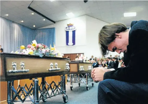  ?? Picture: Terry Shean ?? GRIEF Braam Ackerman, whose mother, Marita, was one of 11 people killed in the St James Church massacre, at the funeral service in 1993.