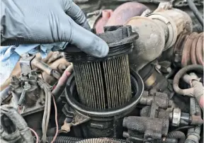  ??  ?? This fuel filter really should’ve been checked and replaced when the truck was first bought, but to our surprise it wasn’t in too rough of shape. Like everything else on the truck, we found the previous owner was religious about keeping up on his scheduled maintenanc­e and fluid changes.