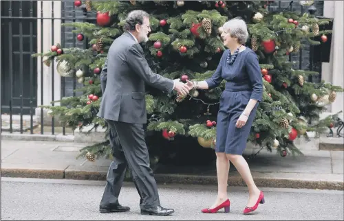  ??  ?? PINING FOR A DEAL: Prime Minister Theresa May greets Spanish Prime Minister Mariano Rajoy for bilateral talks at Downing Street.