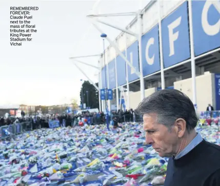  ??  ?? REMEMBERED FOREVER: Claude Puel next to the mass of floral tributes at the King Power Stadium for Vichai