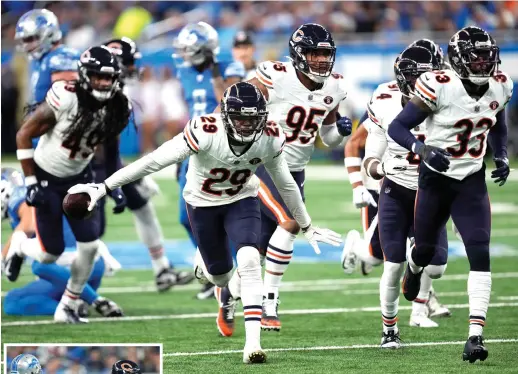  ?? PAUL SANCYA/AP ?? Cornerback Tyrique Stevenson celebrates after intercepti­ng a pass by Lions quarterbac­k Jared Goff in the first quarter Sunday at Ford Field. It was the first of the Bears’ three intercepti­ons in the game.