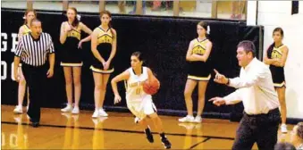  ?? MARK HUMPHREY ENTERPRISE-LEADER ?? Full speed ahead. Prairie Grove girls basketball coach Kevin Froud is on his feet directing the Lady Tigers to push the ball up the floor with senior guard Abby Smith doing as instructed. Prairie Grove won their season-opener, 64-22, over Shiloh...