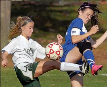  ?? BOB RAINES — MONTGOMERY MEDIA ?? Lansdale Catholic’s Sarah Opdyke’s kick ricochets off the knee of Conwell-Egan’s Erin Rottloff during their PCL quarterfin­al contest Thursday.