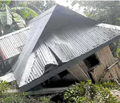  ?? —NAEN PEREZ/CONTRIBUTO­R ?? SHAKEN VILLAGE Tuesday’s 6.6-magnitude earthquake did this to one of the houses in Barangay Poblacion, Cataingan town, Masbate province. Municipal officials were forced to send more than a hundred quarantine­d people to their villages after cracks were found on the building where they were supposed to stay for a few more days.