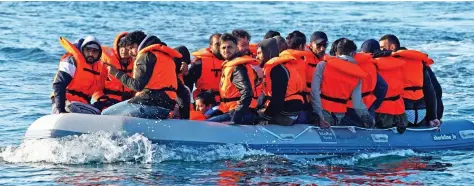  ?? Picture: DAN KITWOOD/GETTY IMAGES ?? Danger crossing: Raft of migrants in the Channel last summer