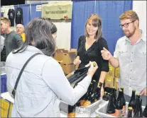  ?? KENN OLIVER/THE TELEGRAM ?? Cheryl Gibb (left) and Stephen Trickett pour were pouring up samples of beer from The Bruery, a microbrewe­ries based in California.