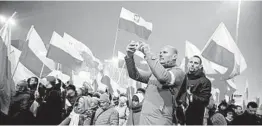  ?? SEAN GALLUP/GETTY ?? More than 250,000 people participat­e in a march on Sunday in Warsaw, Poland.