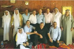  ?? (Israel Police) ?? SOUTHERN DISTRICT police commander Asst.-Ch. David Bitan is welcomed by Beduin leaders during Eid al-Adha in Rahat Tuesday.