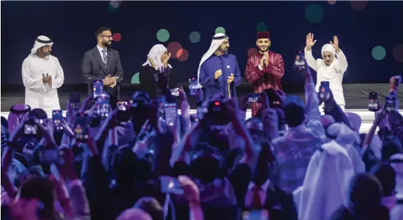  ?? Ruel Pableo for The National ?? Sheikh Mohammed bin Rashid, Vice President and Ruler of Dubai, and Sheikh Hamdan bin Mohammed, Crown Prince of Dubai, with Arab Hope Makers finalists, from left, Dr Mohamed Al Najjar, Fathiya Al Mahmoud, Amin Mounier and Dr Tala Al Khalil, who won the award, at the Coca-Cola Arena in Dubai