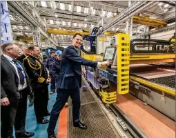  ?? ?? ■ Minister for Defence Procuremen­t, Alex Chalk KC, begins the first cut of steel on the second Type 31 frigate, HMS Active, alongside Babcock’s chief executive officer, David Lockwood, and Vice Admiral Martin Connell, Second Sea Lord