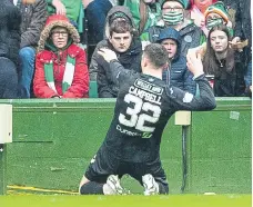  ?? ?? Hibs’ Josh Campbell celebrates after scoring an early penalty