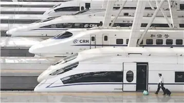  ??  ?? File photo shows bullet trains at the Beijing South Railway Station. The LTA said they had extensive experience in HSR projects internatio­nally, including in the planning and design of the Beijing South HSR Station in China. — Reuters photo