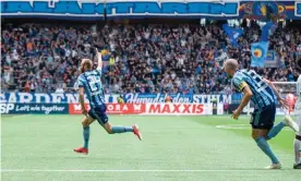  ??  ?? Curtis Edwards wheels away after scoring for Djurgården at their home ground, Tele2 Arena. Photograph: Kenth Norberg
