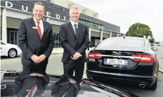  ?? PHOTO: STEPHEN JAQUIERY ?? Polished service . . . Steve McNulty (left), of Classic Jaguar Limousines Ltd, and Geoff Preston, of Preston Black, wait for customers at the new limousine rank outside Dunedin Airport, which opened yesterday.