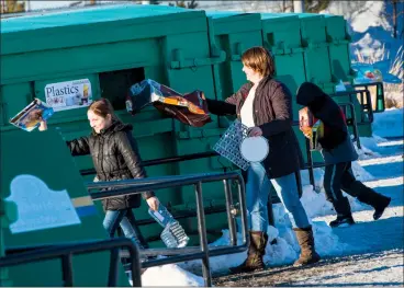  ?? @IMartensHe­rald Herald photo by Ian Martens ?? Pascale Brown and her children Elizabeth and Owen drop off recyclable­s this week at the Stafford Drive North Recycling Station. The City says that plans for curbside recycling remain unchanged despite changes to the internatio­nal recycling market.