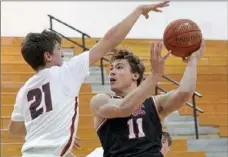  ?? Matt Freed/Post-Gazette ?? Upper St. Clair's David Pantelis (No. 11) is a Yale football recruit, but he recently had a basketball game with 24 points, 12 rebounds, 10 steals and 7 assists.