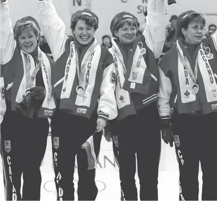  ?? PHOTO QC FILE ?? Marcia Gudereit (left to right), Joan McCusker, Jan Betker and Sandra Schmirler celebratin­g Olympic gold 20 years ago.
