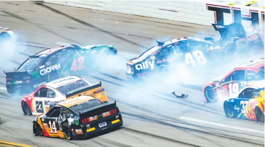  ?? AP PHOTO/GREG MCWILLIAMS ?? Ross Chastain (42) and Alex Bowman (48) get sideways during a NASCAR Cup Series race on Oct. 4 in Talladega, Ala.