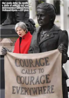  ??  ?? May speaks during the unveiling of a statue of suffragist and women’s rights campaigner Millicent Fawcett in Parliament Square. — AFP photo