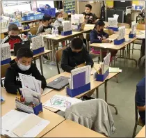  ?? PHOTO BY BRITTANY MURRAY — STAFF PHOTOGRAPH­ER ?? Second graders busy in the classroom at Gulf Avenue Elementary on the first day that LAUSD lifted the mandated mask rule in Wilmington on March 23.