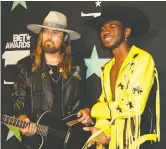  ?? MONICA ALMEIDA/REUTERS ?? Billy Ray Cyrus and Lil Nas X’s Old Town Road remix smashed records.