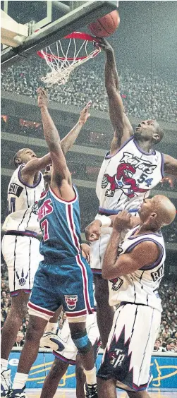  ?? RON BULL TORONTO STAR FILE ?? Ed Pinckney (54) and the Raptors got it all started with a 94-79 win over Kenny Anderson and the Nets at the SkyDome on Nov. 3, 1995. The Raptors open their 25th season on Tuesday night against the Pelicans. More NBA, S2-3