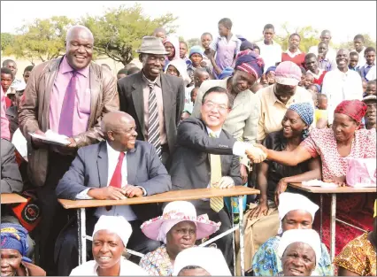  ??  ?? Chinese Ambassador to Zimbabwe Mr Huang Ping is welcomed by villagers in the company of Zimbabwe Prisons and Correction­al Services Commission­er-General Retired Major-General Paradzai Zimondi (seated) and Uzumba National Assembly Member Simba Mudarikwa during a donation of equipment by the Embassy to Hombiro Clinic in Uzumba yesterday. — (Picture by Innocent Makawa)