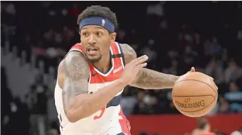  ?? AP ?? Wizards guard Bradley Beal will not play when the season resumes because of a right rotator-cuff injury.