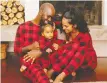  ??  ?? The Smash + Tess Poinsettia Plaid romper is fit for the whole family.