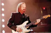  ?? OKLAHOMAN ARCHIVES] [PHOTO BY DOUG HOKE, THE ?? Tom Petty and the Heartbreak­ers perform April 20 during the 40th anniversar­y tour stop at the Chesapeake Energy Arena in downtown Oklahoma City.