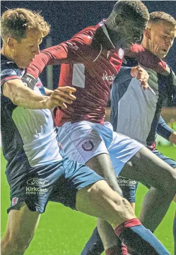  ?? ?? LET’S GET PHYSICAL: Raith defender Christophe Berra, left, said Arbroath loan striker Joel Nouble was one of the most difficult opponents he had played against.