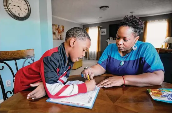  ?? Mark Humphrey/Associated Press ?? The progress report for Tamela Ensrud’s second-grade son in Nashville shows mostly As and a B in English, but she noticed he was having trouble with reading.