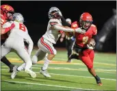  ?? MATT BATES — ENTERPRISE-RECORD ?? Chico’s Dion Coleman stiff-arms Foothill’s Joel Christ on Oct. 15, 2021, in Chico.