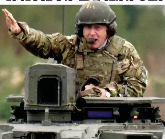  ??  ?? Fighting back: As his row with EU chiefs heated up, Boris Johnson, in full combat gear, went on manoeuvres on a Challenger tank with British Army troops in Estonia – deployed with Nato in a sign of the UK’s commitment to European security